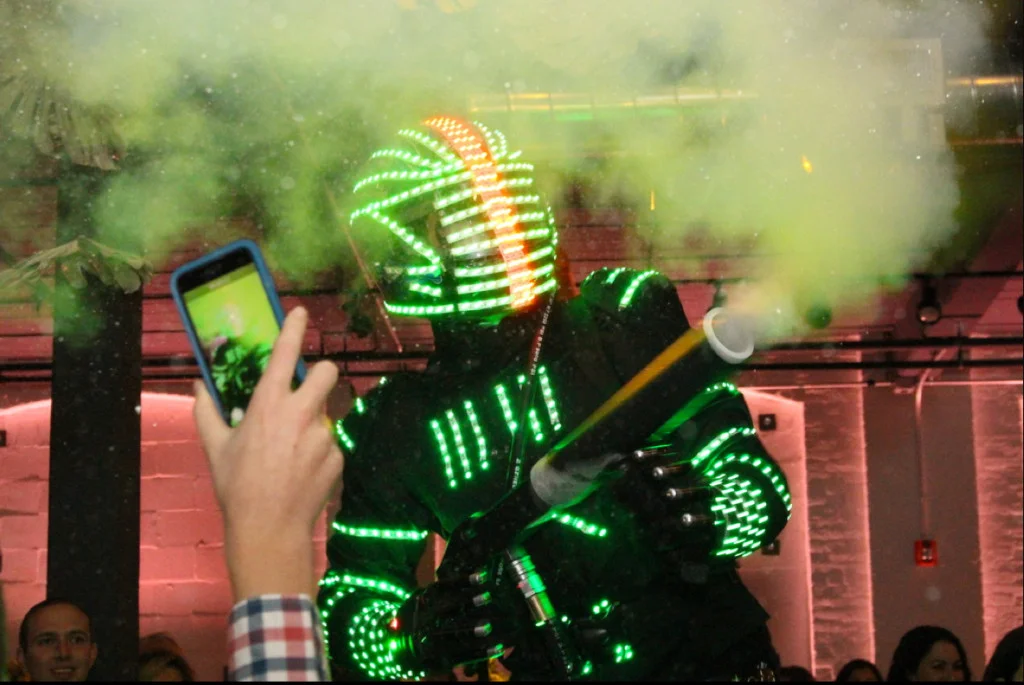 A person recording a robot man