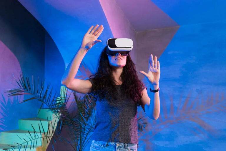 Woman wearing a virtual reality headset and raising her hands while interacting with an immersive virtual environment